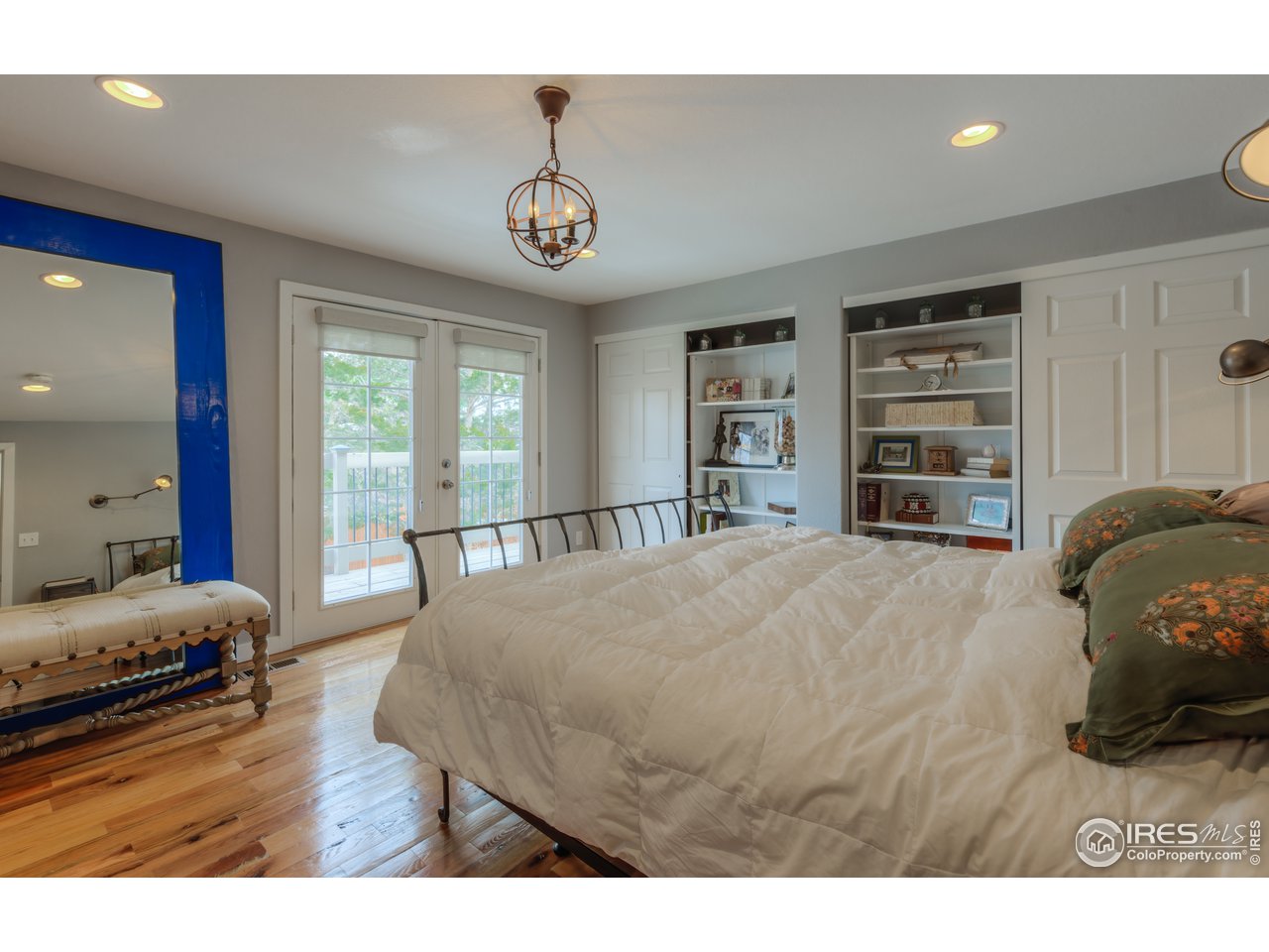 340 18th Street Boulder, CO 80302 - Photo 16 of 40 Upper level Primary Bedroom - French doors open to beautiful backyard below.