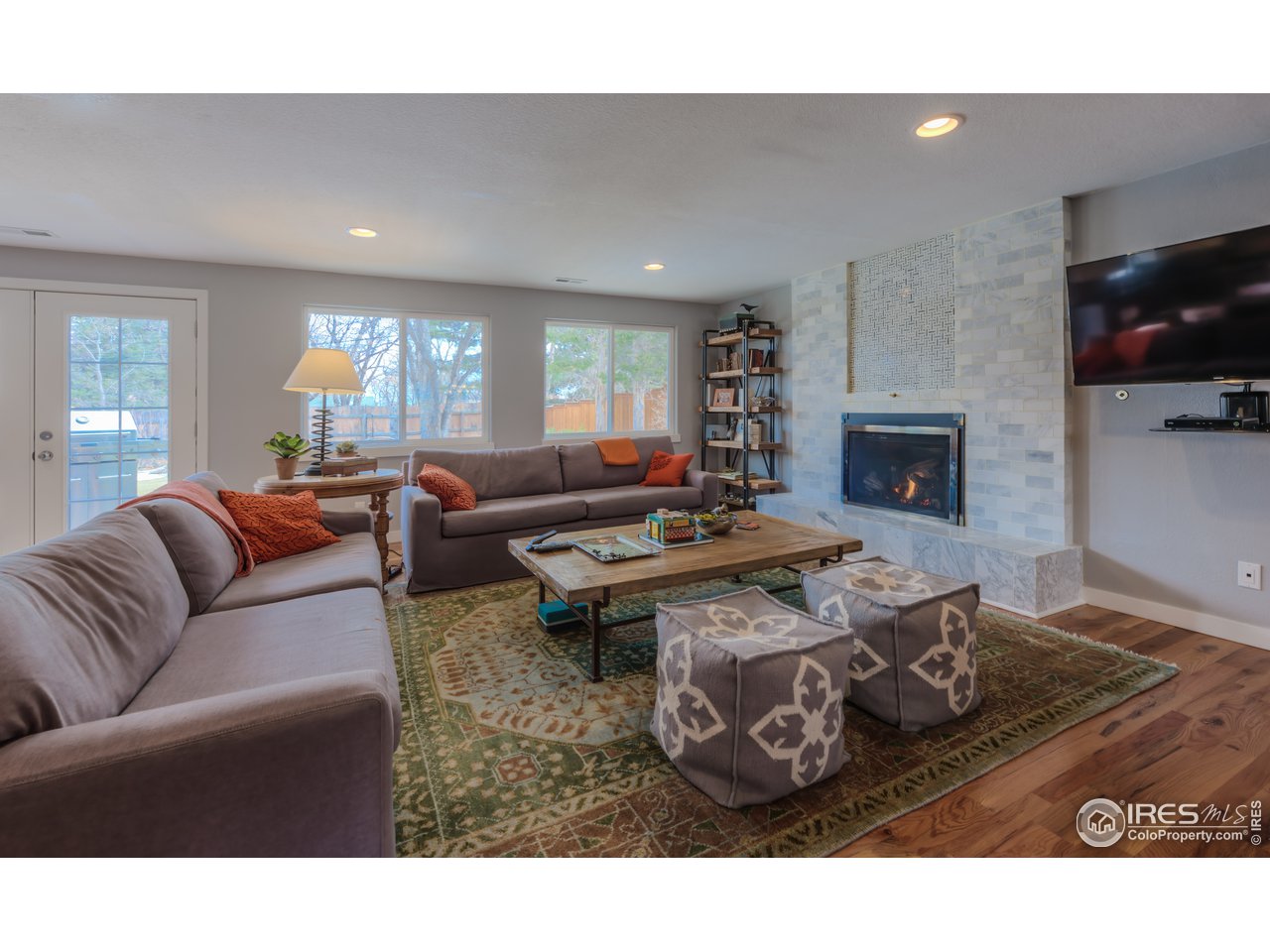 340 18th Street Boulder, CO 80302 - Photo 7 of 40 Lower level Family Room with gas fireplace