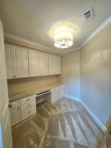 en empty room with cabinets