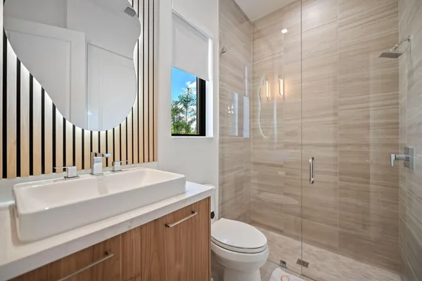 a large kitchen with kitchen island a sink table and chairs
