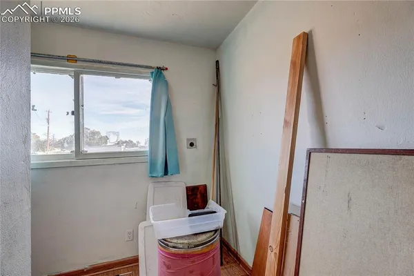 a room with gym equipment and a fireplace