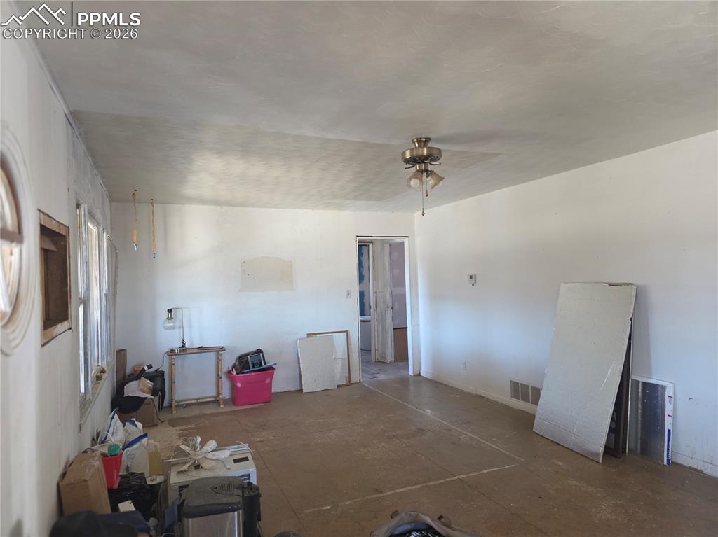 952 Twin Lakes Road Walsenburg, CO 81089 - Photo 32 of 34 a living room with furniture and a flat screen tv