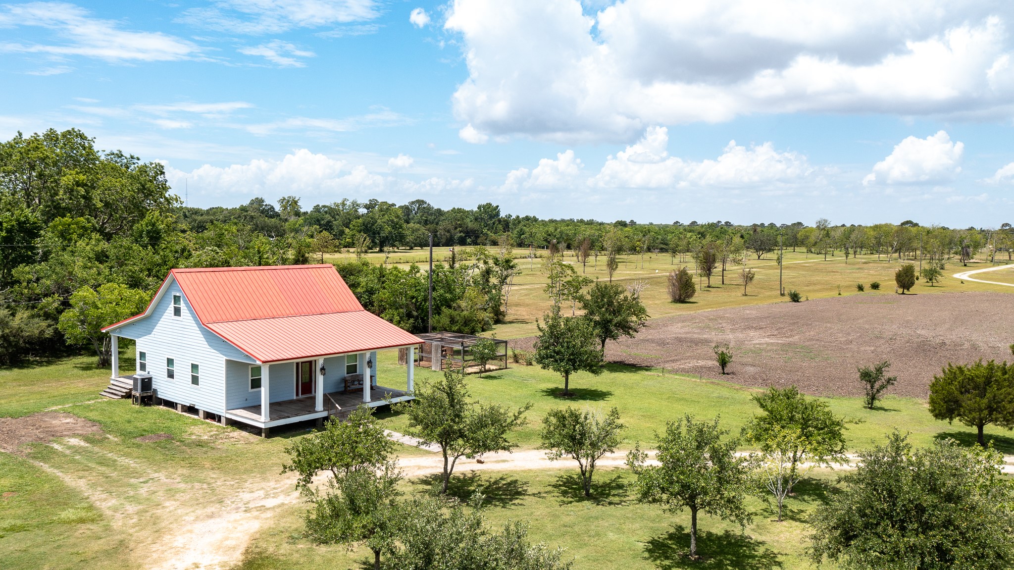 14328 Fm 2354 Rd Beach Baytown, TX 77523 - Photo 15 of 47 a aerial view of a house with yard and lake view