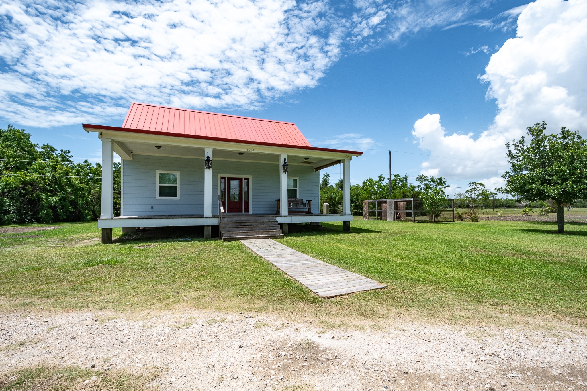 14328 Fm 2354 Rd Beach Baytown, TX 77523 - Photo 17 of 47 a view of a house with backyard porch and garden