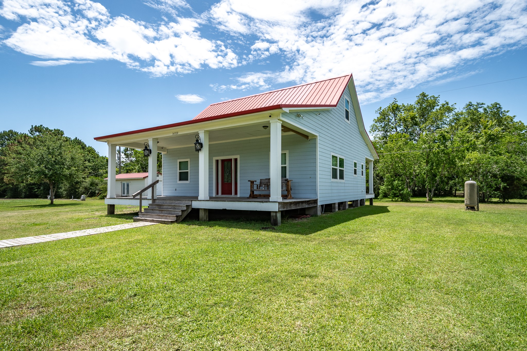 14328 Fm 2354 Rd Beach Baytown, TX 77523 - Photo 18 of 47 a view of a house with a yard and sitting area