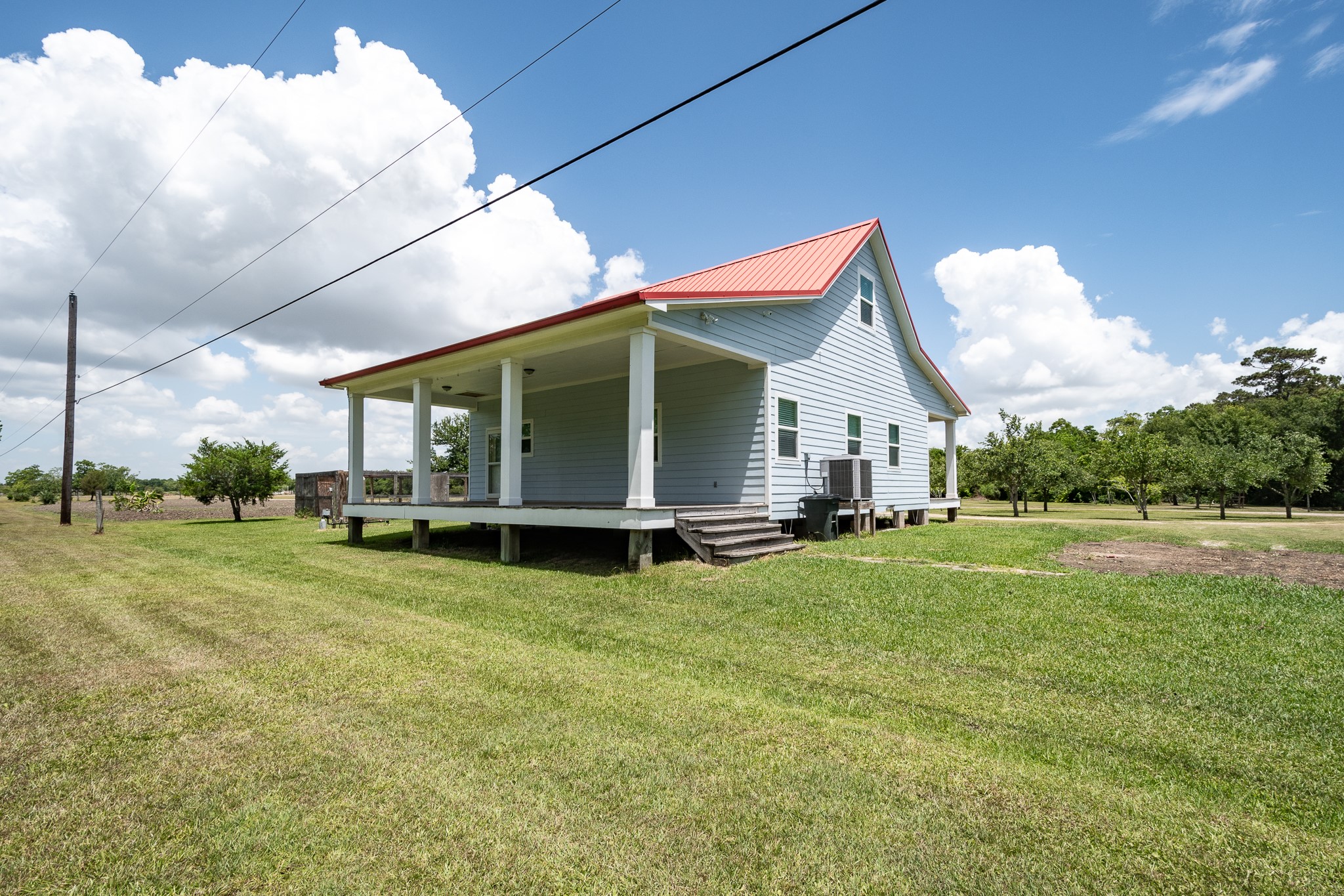 14328 Fm 2354 Rd Beach Baytown, TX 77523 - Photo 22 of 47 a view of a house with a backyard
