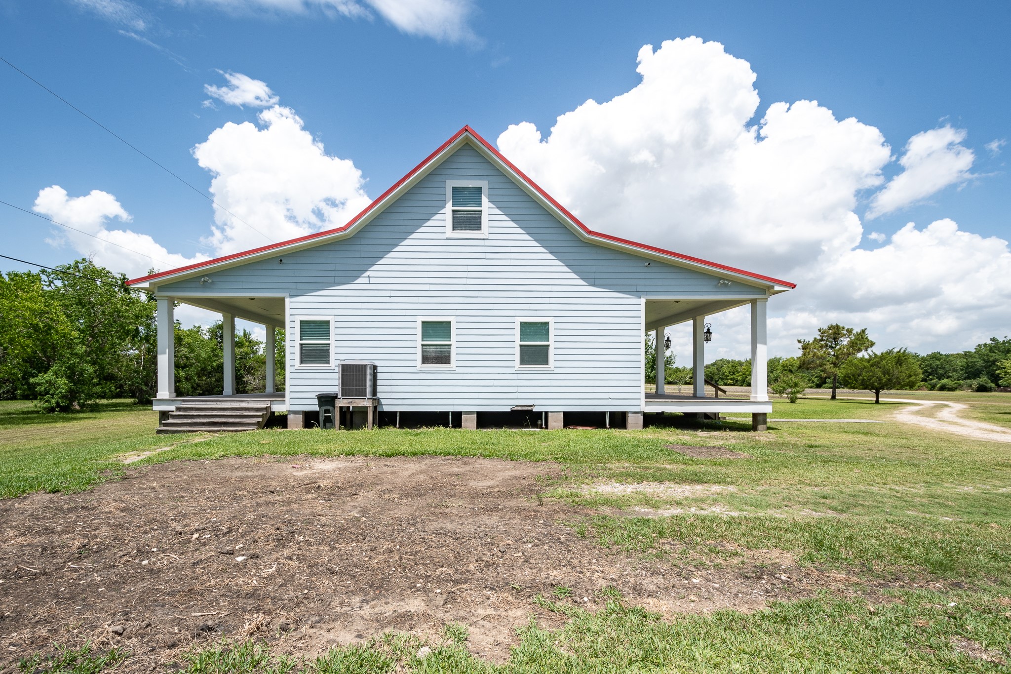 14328 Fm 2354 Rd Beach Baytown, TX 77523 - Photo 23 of 47 a view of a house with a yard and sitting area