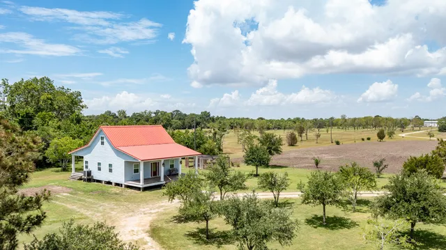 a view of an ocean house and a yard