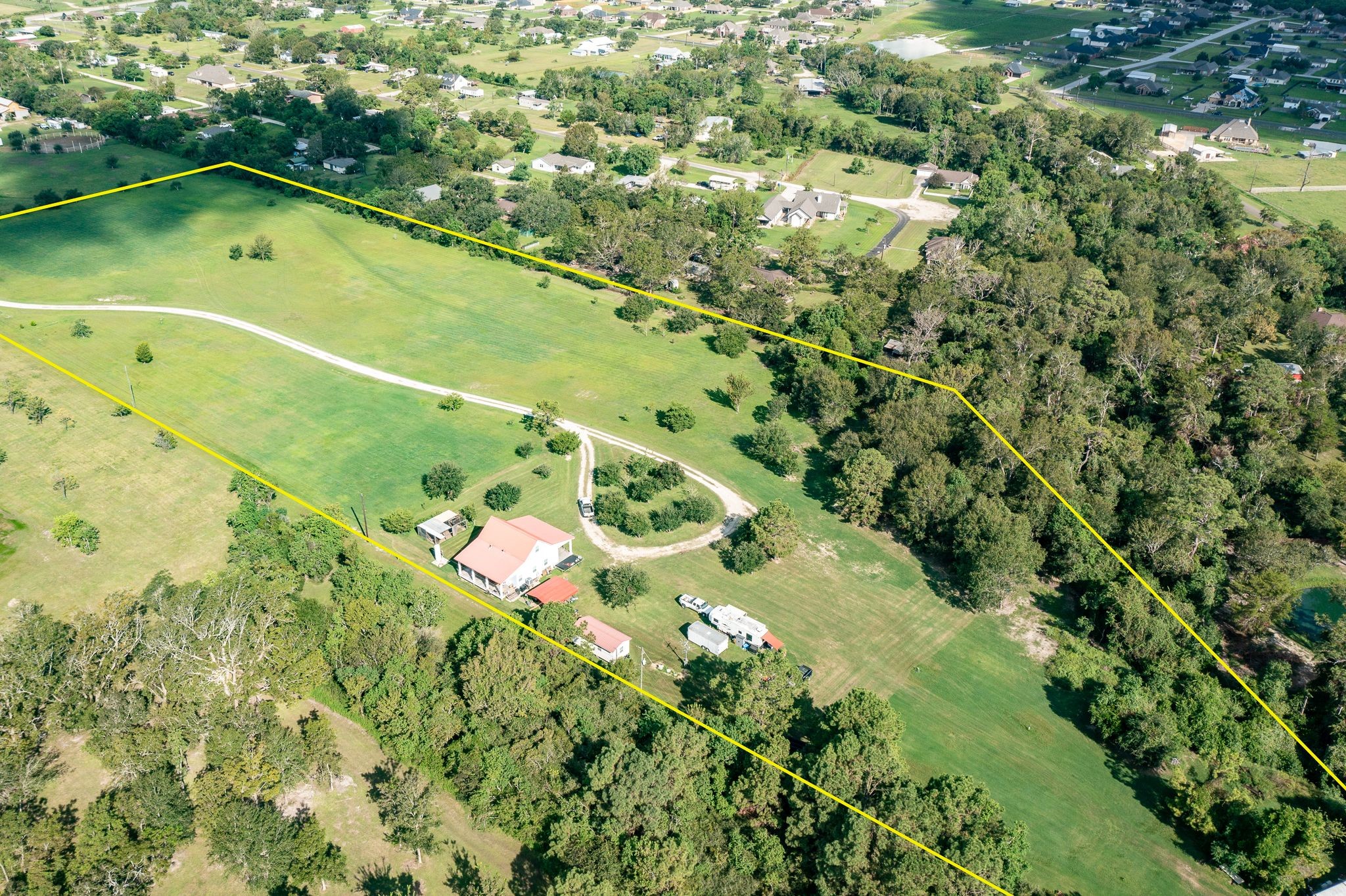 14328 Fm 2354 Rd Beach Baytown, TX 77523 - Photo 8 of 47 an aerial view of a residential houses with outdoor space and trees all around