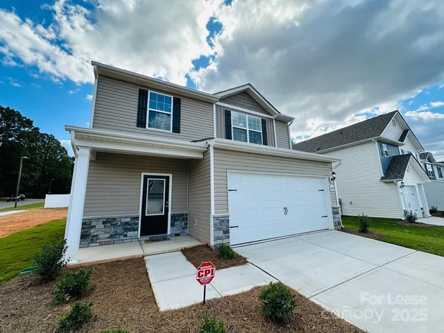 a front view of a house with yard