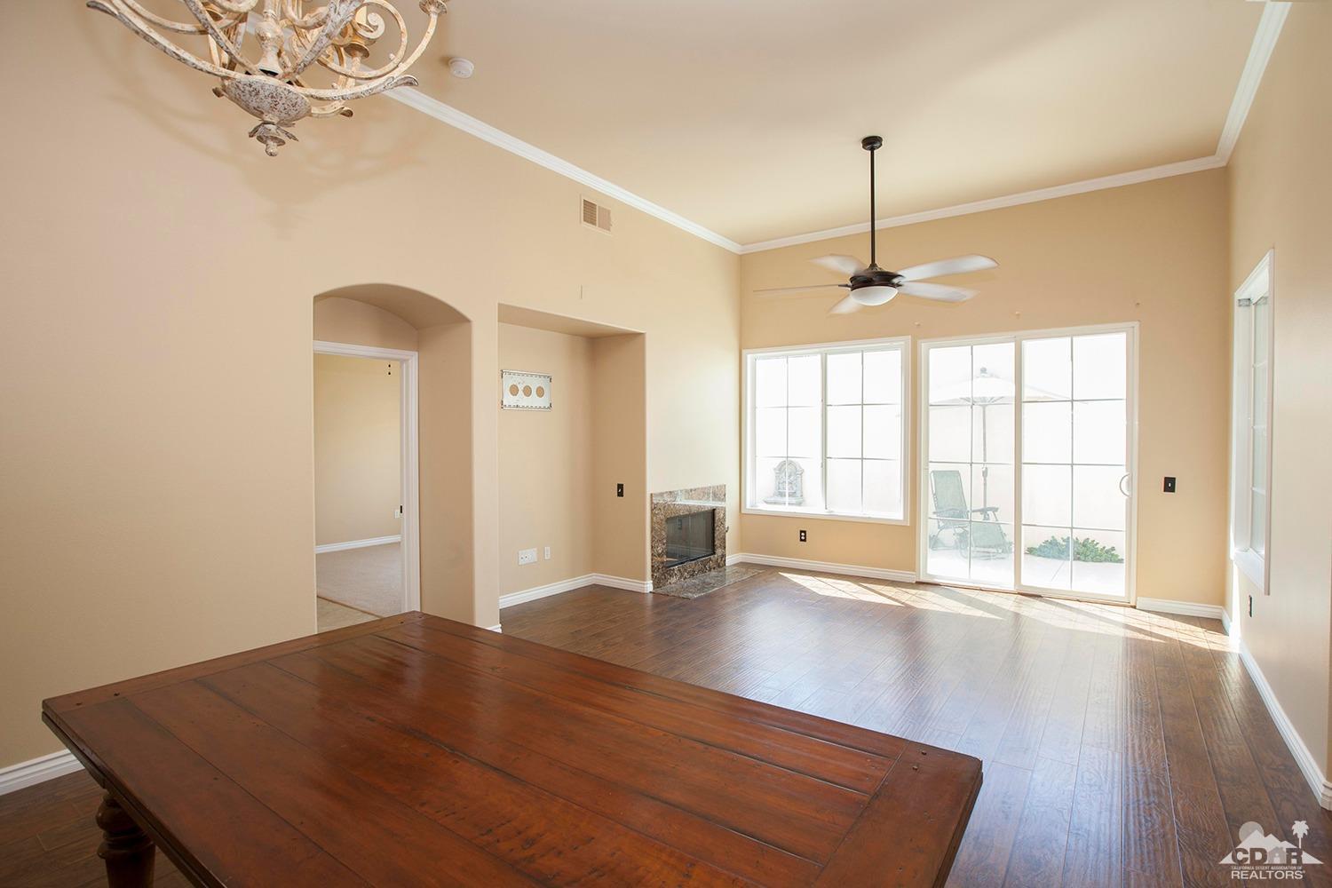 79338 Cool Reflection La Quinta, CA 92253 - Photo 2 of 16 a view of a livingroom with a ceiling fan and window