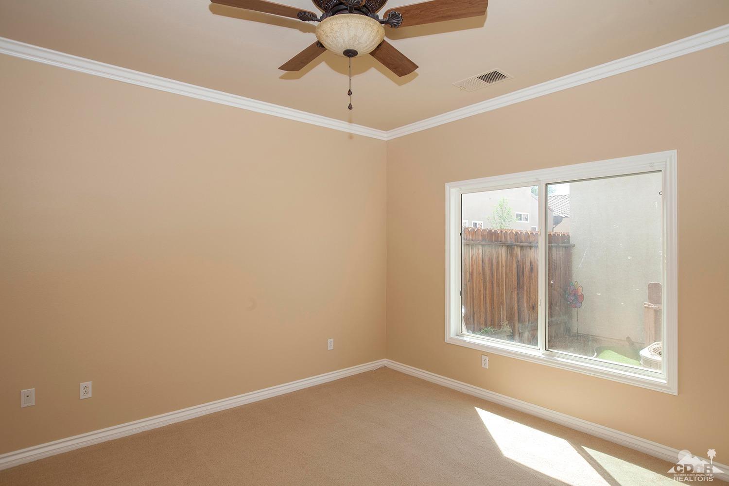 79338 Cool Reflection La Quinta, CA 92253 - Photo 13 of 16 a view of an empty room with a window