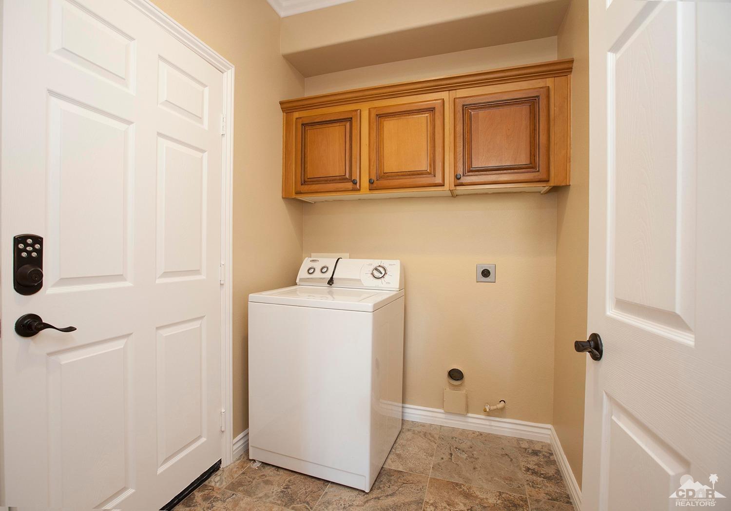 79338 Cool Reflection La Quinta, CA 92253 - Photo 16 of 16 a utility room with dryer and washer