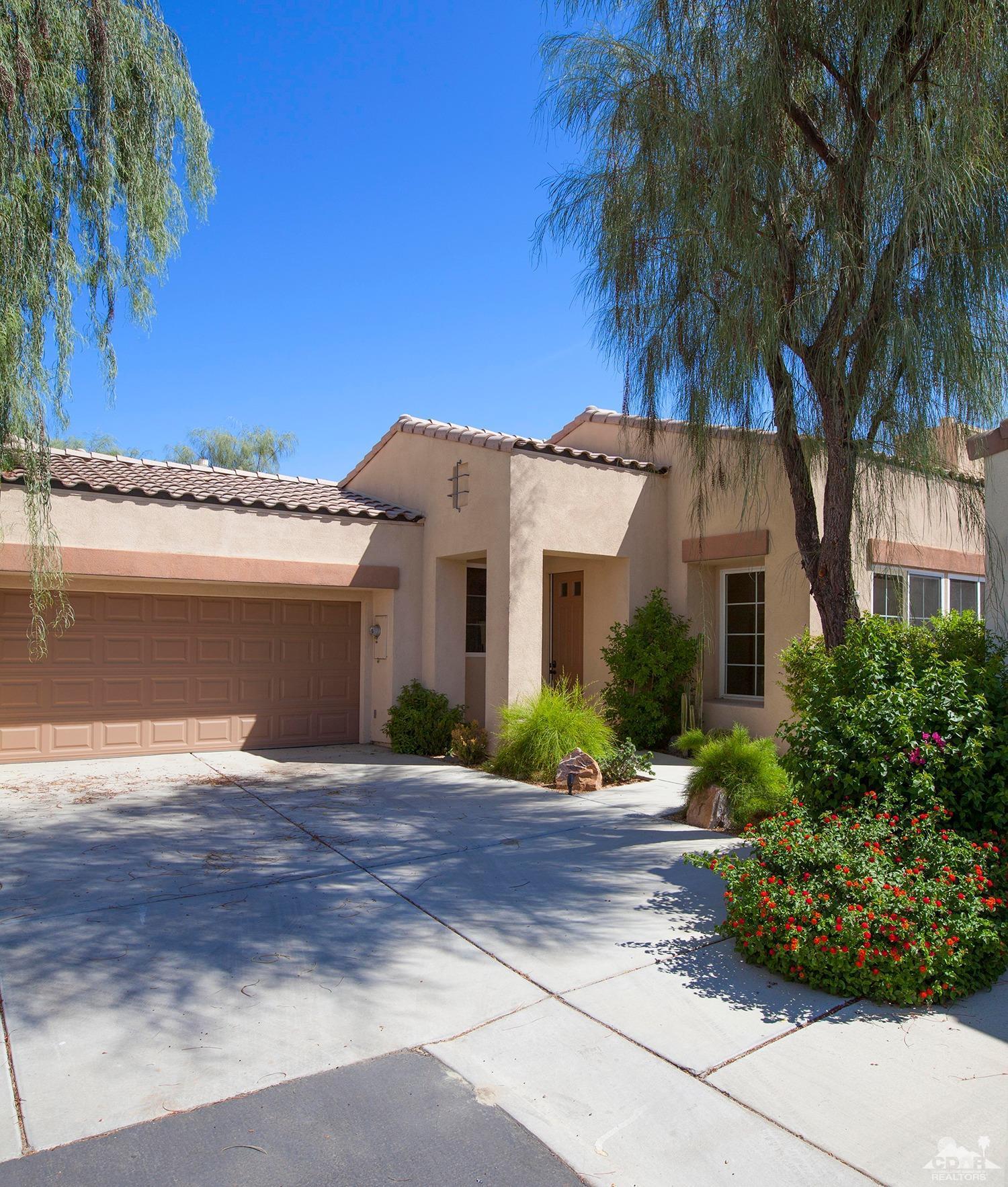 79338 Cool Reflection La Quinta, CA 92253 - Photo 4 of 16 a front view of a house with a garden