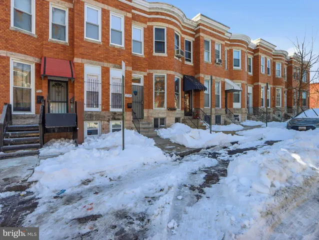 a row of houses with a street
