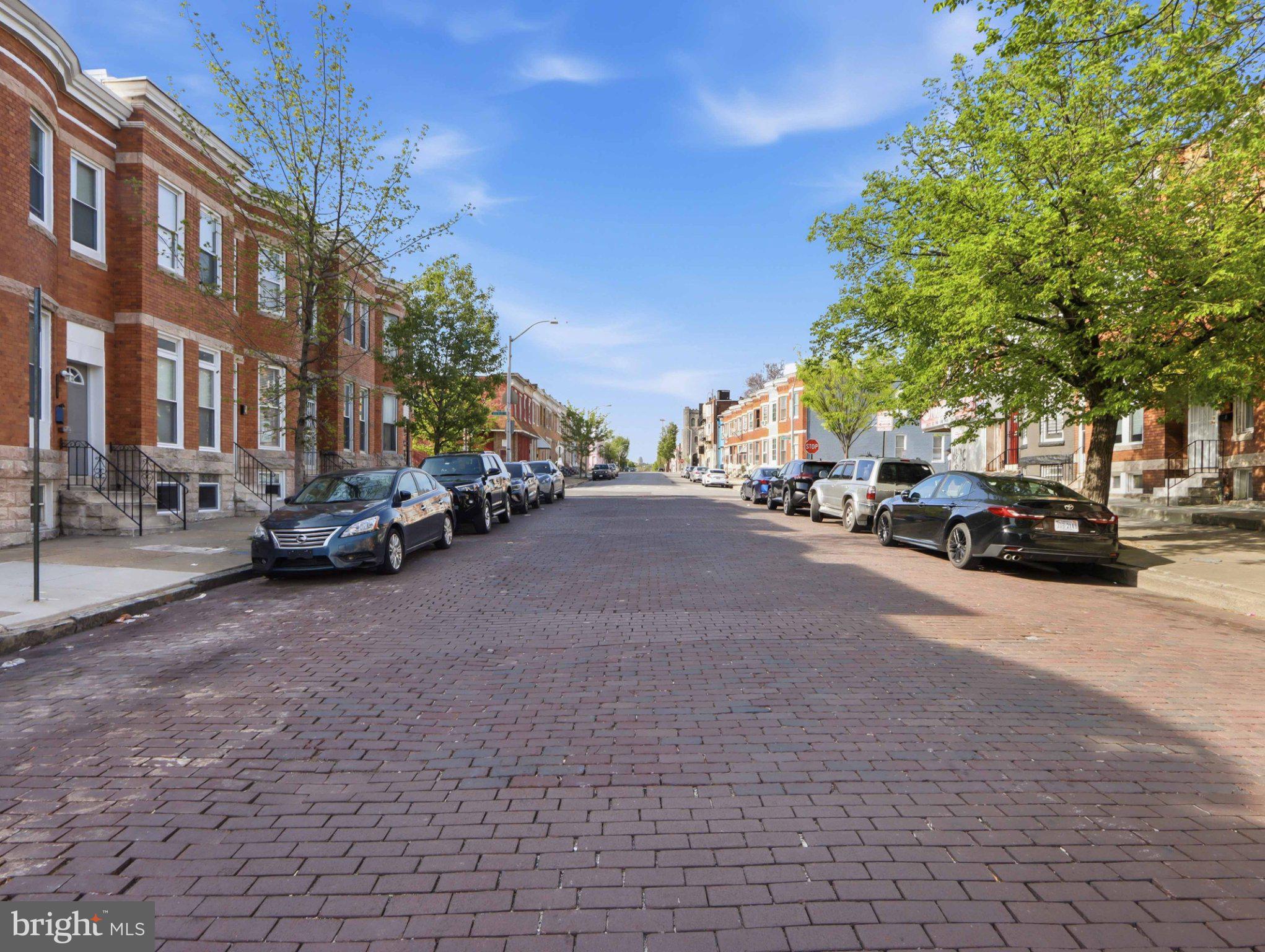 1724 North Payson Street Baltimore, MD 21217 - Photo 39 of 41 Charming brick street lined with trees.