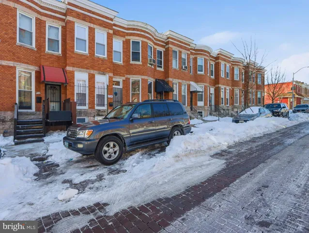 a car parked in front of a building