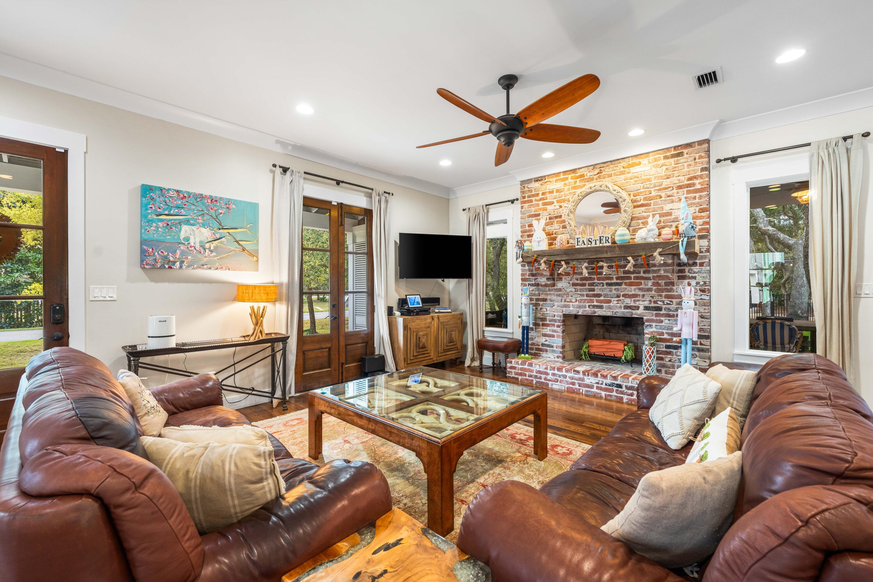 184 Crescent Road Santa Rosa Beach, FL 32459 - Photo 25 of 61 a living room with furniture fireplace and a large window