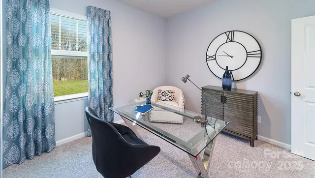 a bedroom with a bed and a lamp