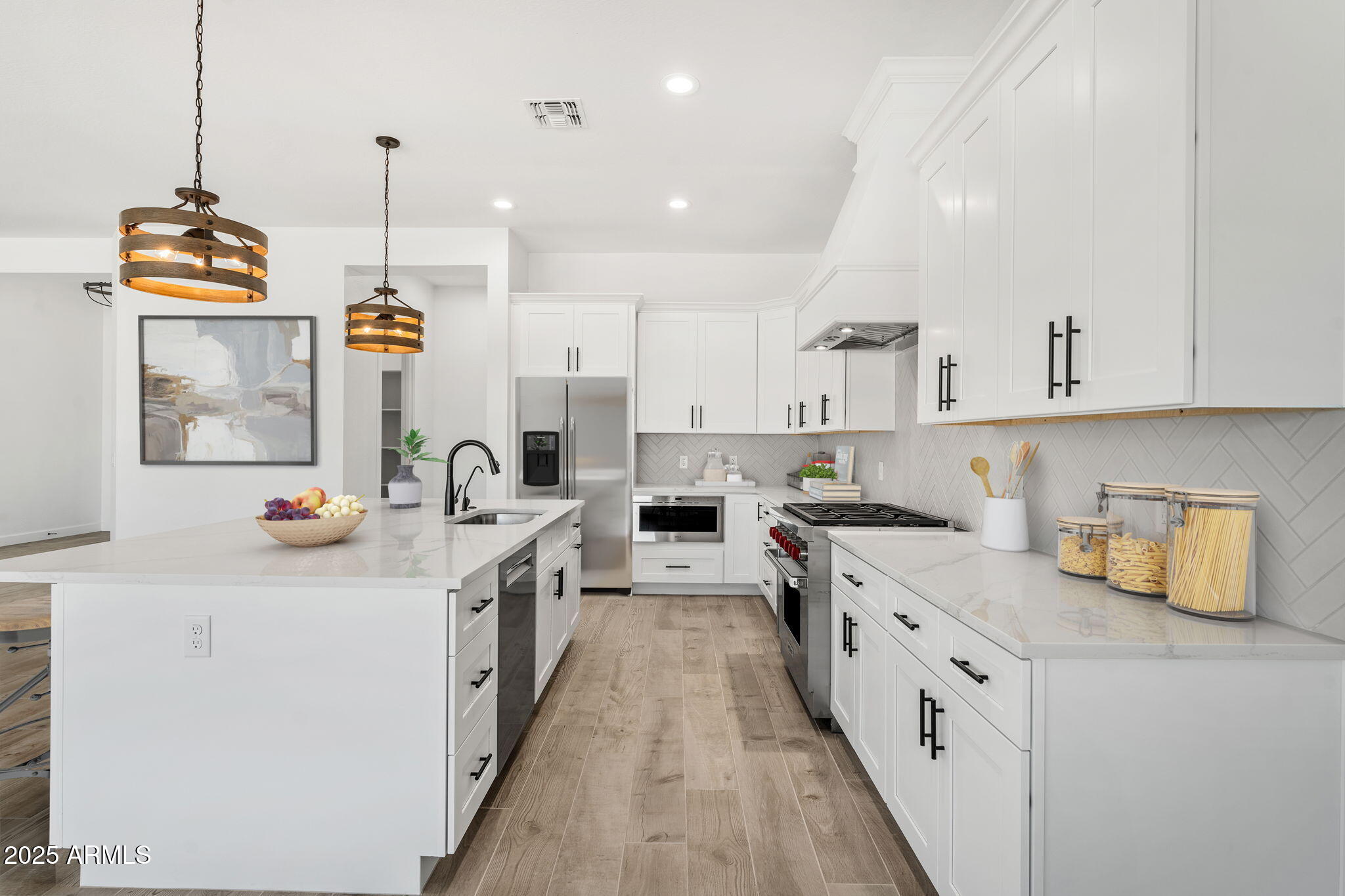 17083 East Dl Lane Rio Verde, AZ 85263 - Photo 3 of 22 a kitchen with stainless steel appliances granite countertop a sink a stove and a wooden floors