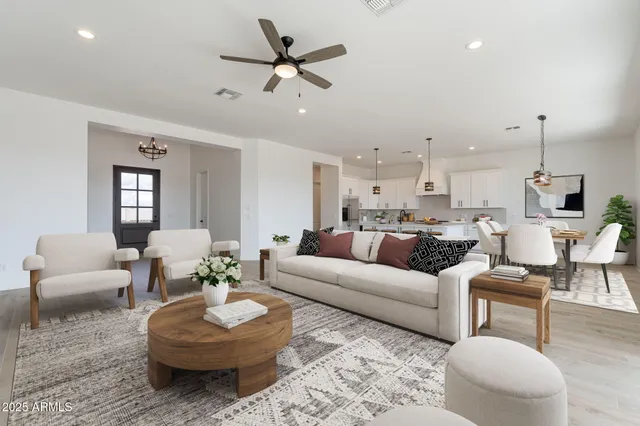 a living room with furniture and a large mirror