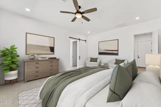 a bedroom with a bed and a dresser