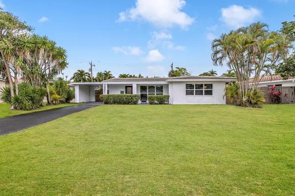 a view of a house with a big yard