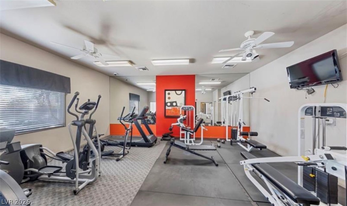7701 West Robindale Road, Unit 274 Las Vegas, NV 89113 - Photo 41 of 43 Equipped with diverse machines, this fitness room caters to all workout preferences.