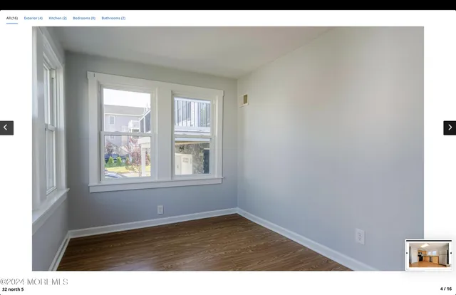 a view of an empty room and window