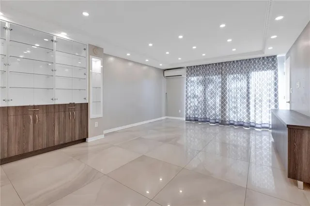 a view of an empty room with a fireplace