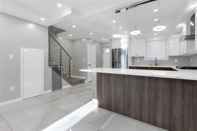 a large bathroom with a large mirror and sink