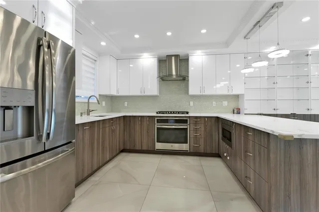 a kitchen with a sink stove and refrigerator