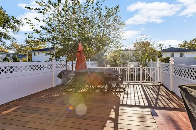 a view of balcony with wooden floor