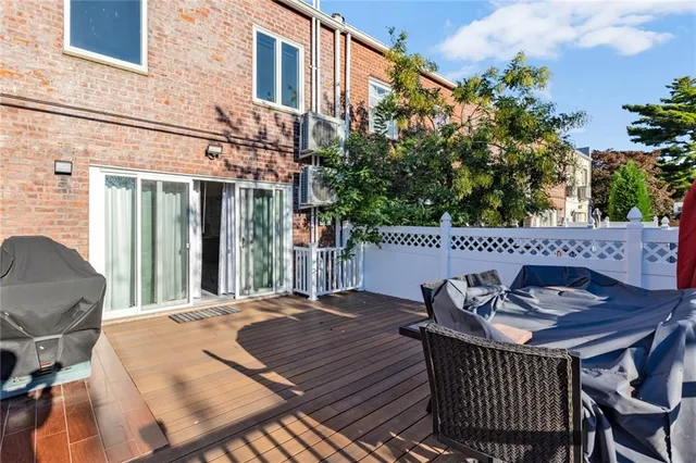 a view of a patio with table and chairs and potted plants