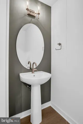 a bathroom with a sink and mirror