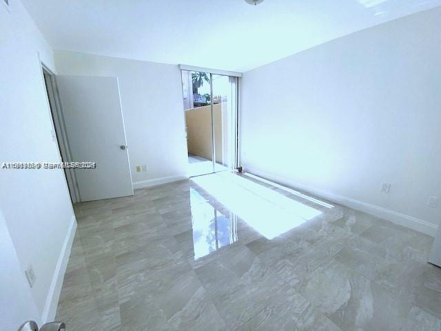 10801 Southwest 109th Court, Unit D103 Miami, FL 33176 - Photo 11 of 12 wooden floor in an empty room
