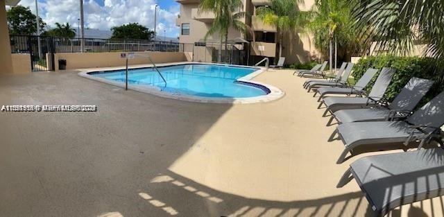 10801 Southwest 109th Court, Unit D103 Miami, FL 33176 - Photo 12 of 12 swimming pool view with a outdoor seating