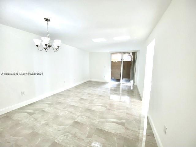 10801 Southwest 109th Court, Unit D103 Miami, FL 33176 - Photo 2 of 12 a view of an empty room with a window