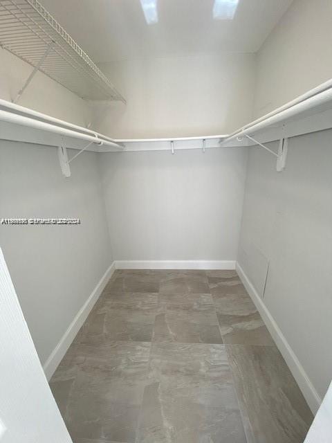 10801 Southwest 109th Court, Unit D103 Miami, FL 33176 - Photo 7 of 12 a view of a room with racks on the wall
