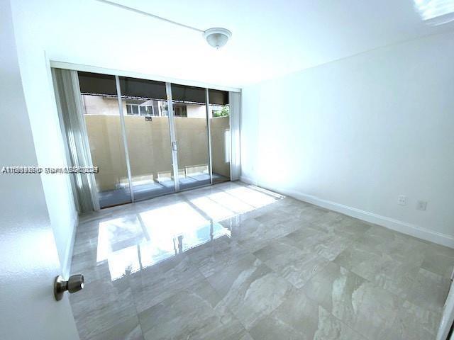 10801 Southwest 109th Court, Unit D103 Miami, FL 33176 - Photo 9 of 12 a view of a big room with wooden floor
