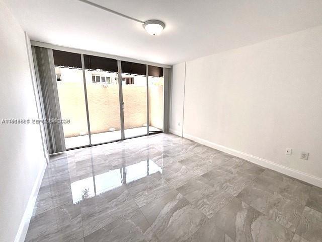 10801 Southwest 109th Court, Unit D103 Miami, FL 33176 - Photo 10 of 12 an empty room with windows