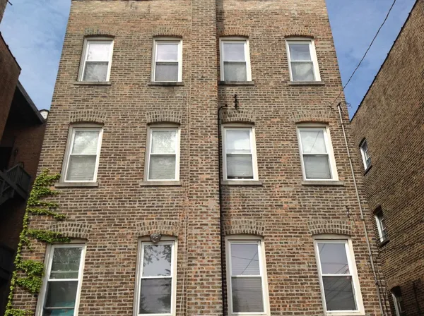a building view with a brick wall