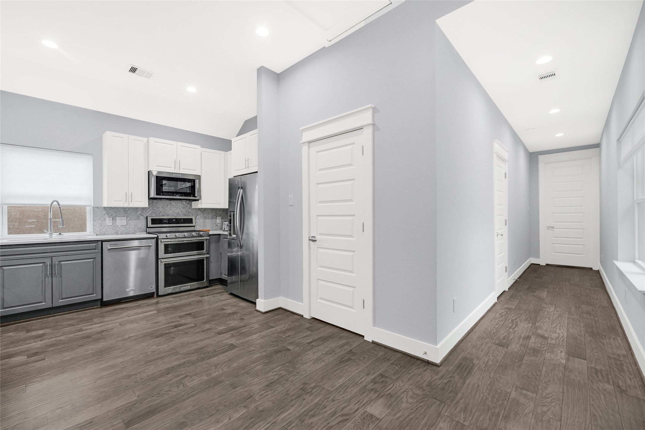 6118 Truro Street Houston, TX 77007 - Photo 18 of 39 a kitchen with a refrigerator and a stove top oven