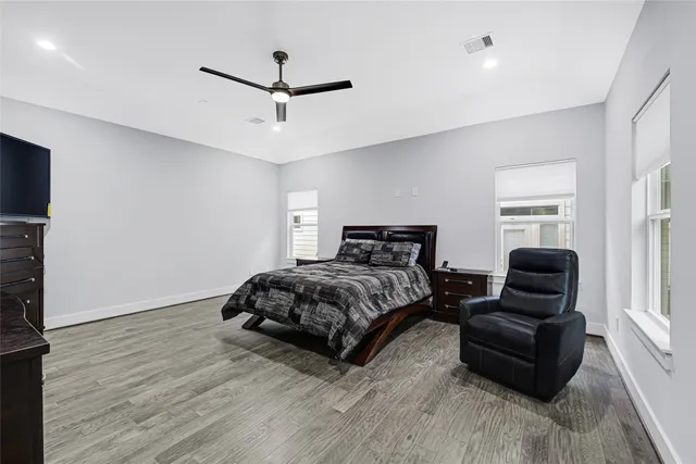 a bedroom with a bed and a television