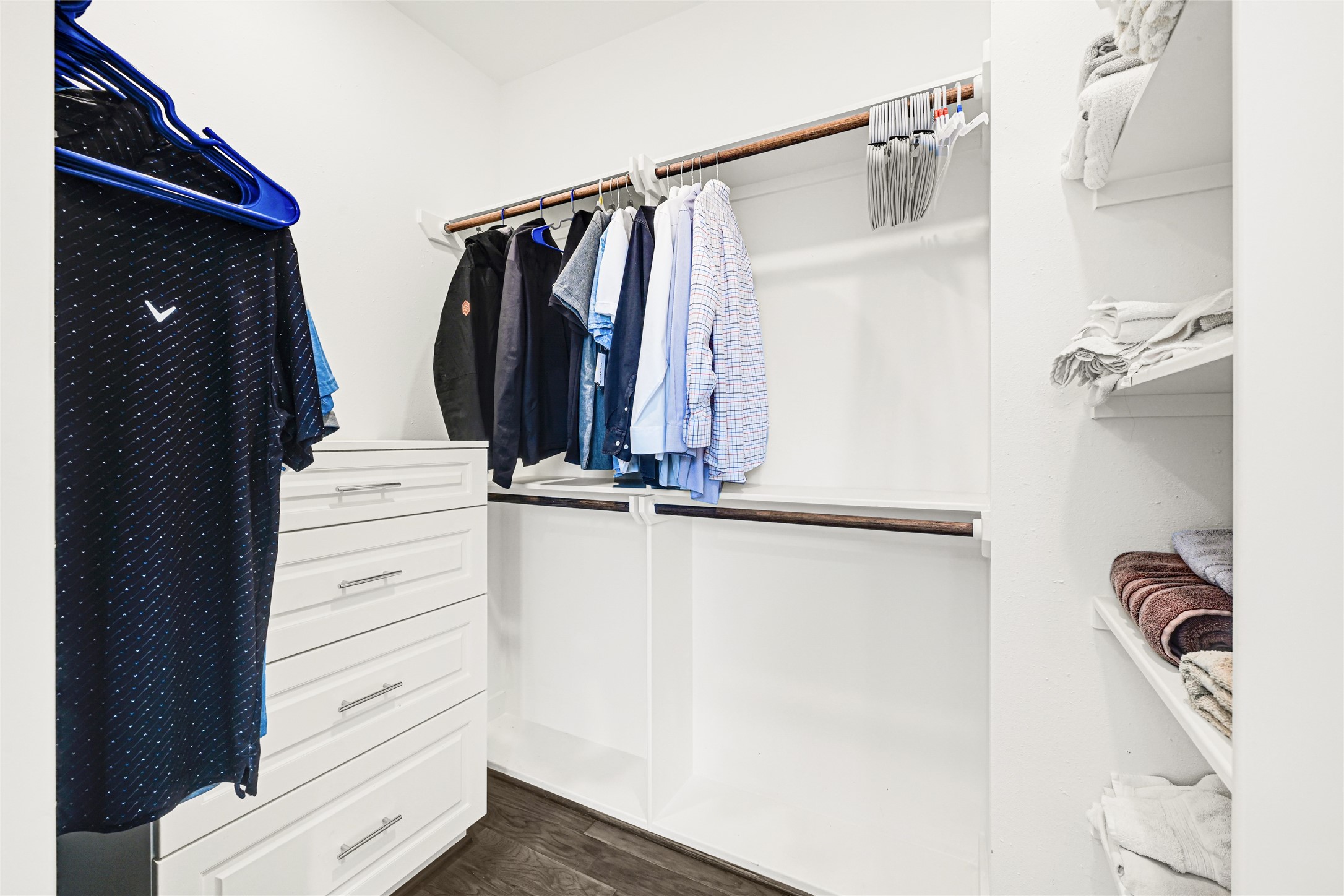 6118 Truro Street Houston, TX 77007 - Photo 24 of 39 a view of walk in closet with clothes and shoes