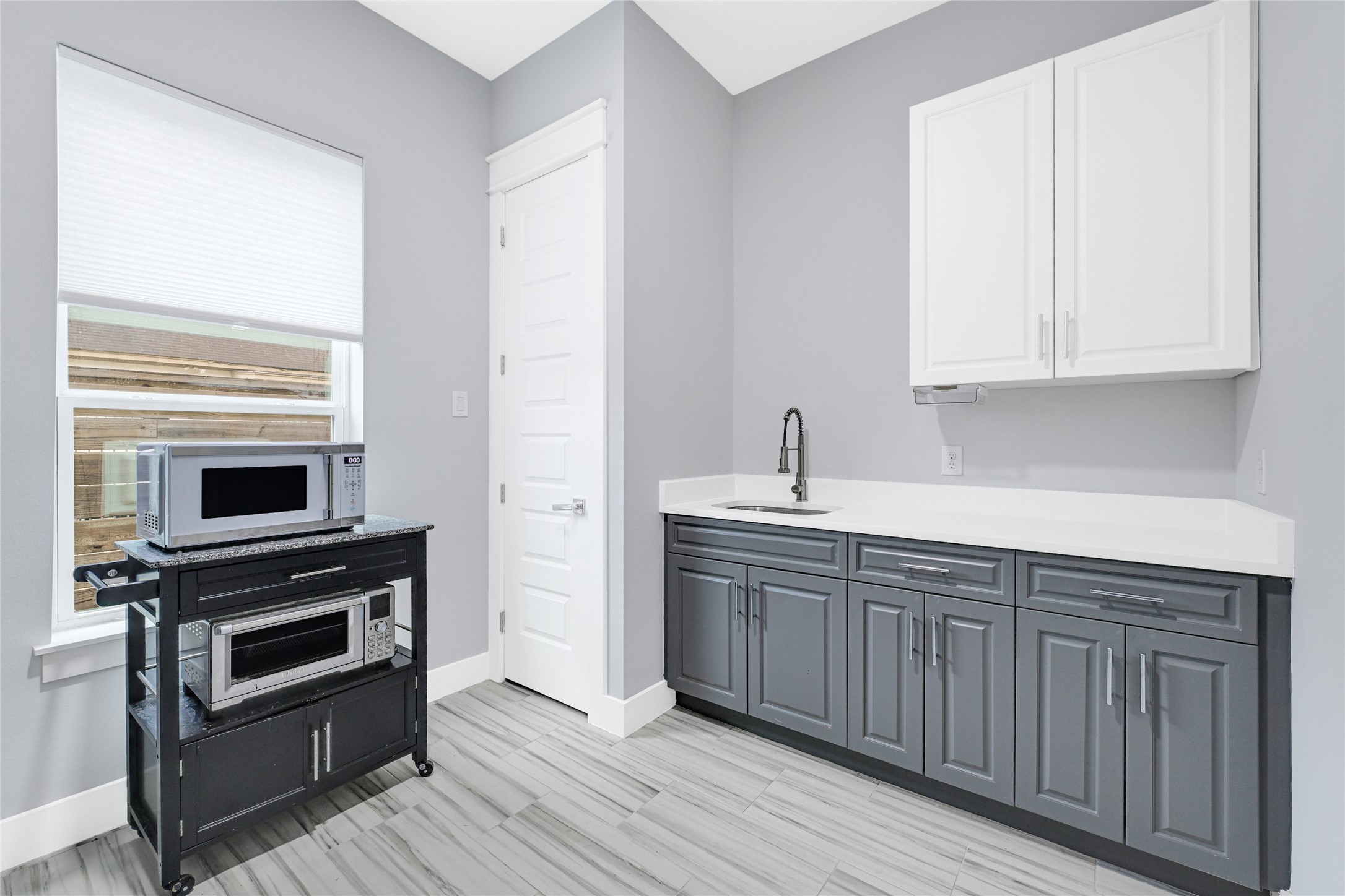 6118 Truro Street Houston, TX 77007 - Photo 25 of 39 a kitchen with sink cabinets and stainless steel appliances