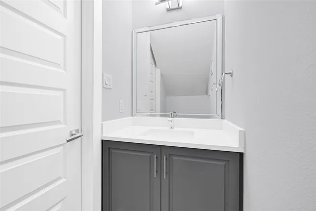 a bedroom with a bed and large window