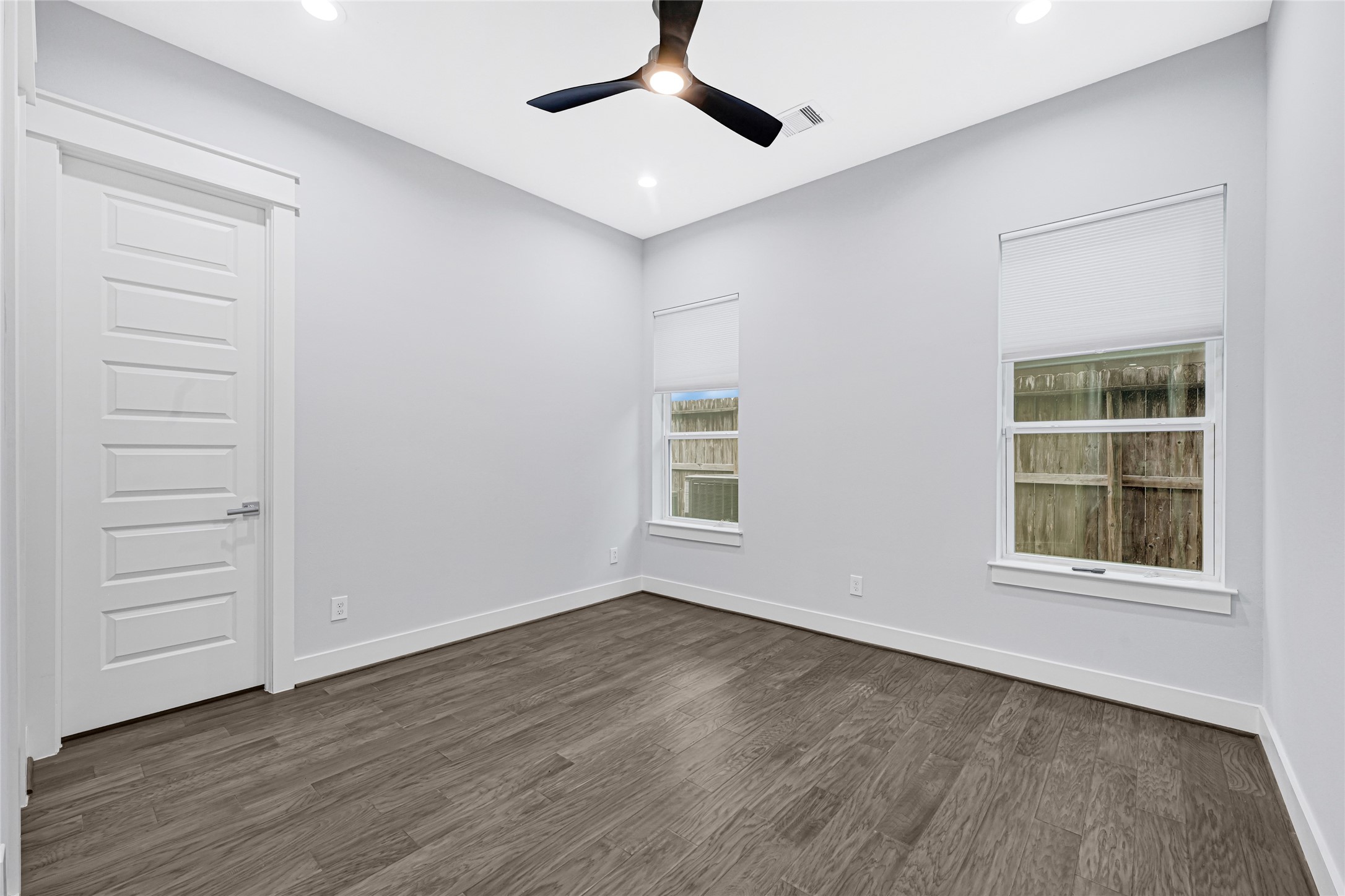 6118 Truro Street Houston, TX 77007 - Photo 31 of 39 wooden floor in an empty room with a window