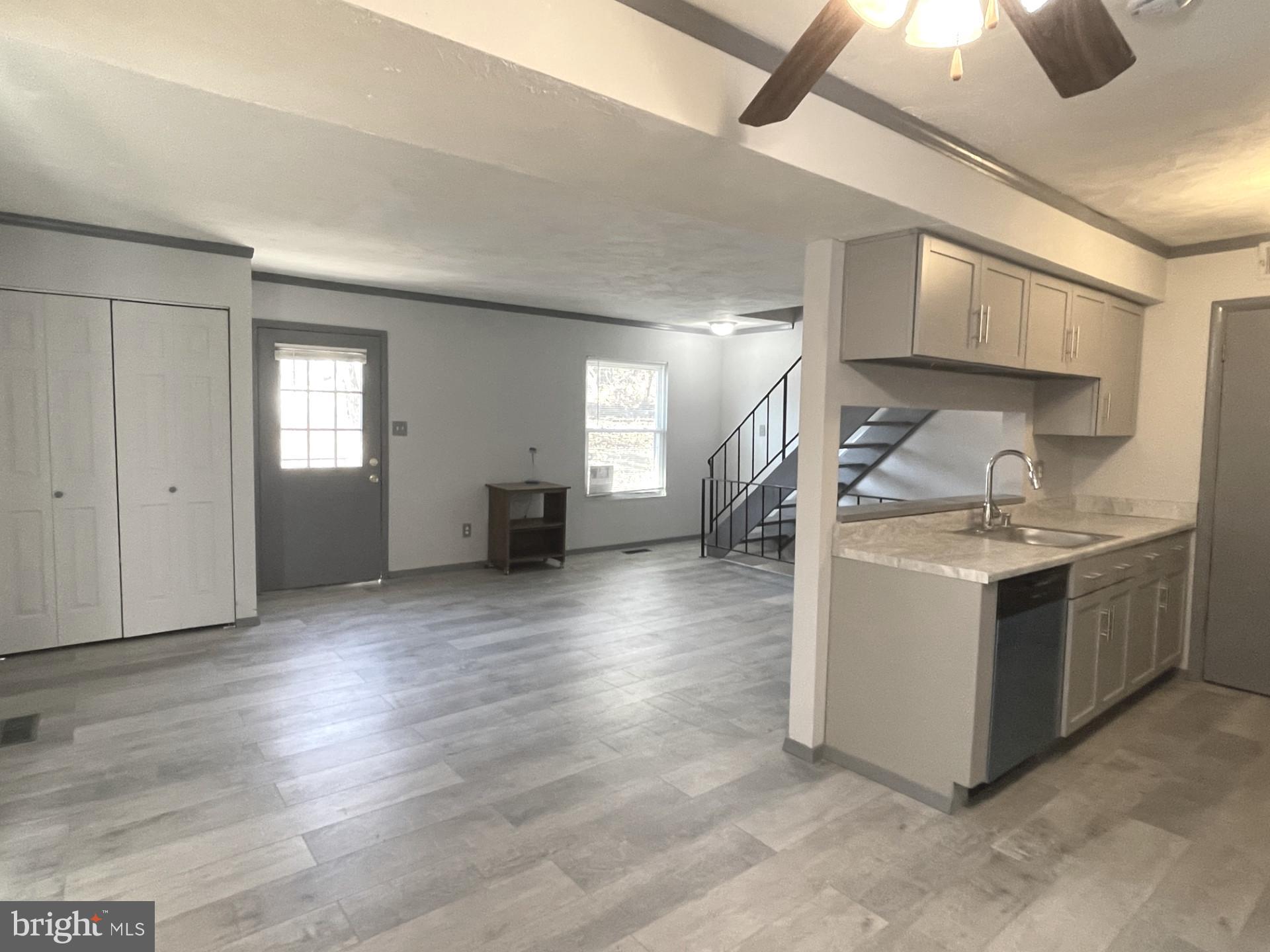 6 Ridgelawn Road, Unit C Reisterstown, MD 21136 - Photo 11 of 28 a view of a kitchen with a sink and a stove top oven