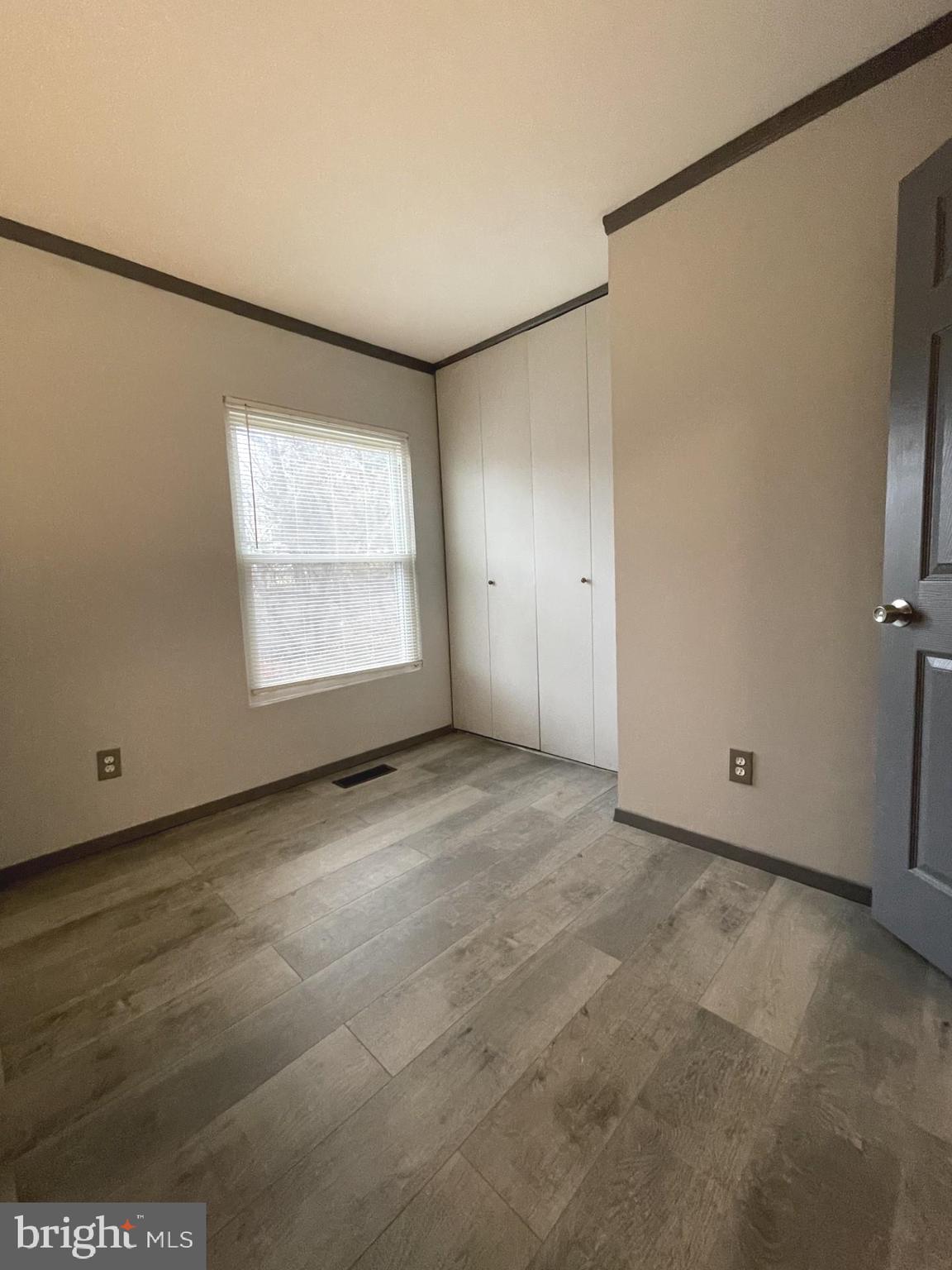 6 Ridgelawn Road, Unit C Reisterstown, MD 21136 - Photo 22 of 28 a view of an empty room with a window